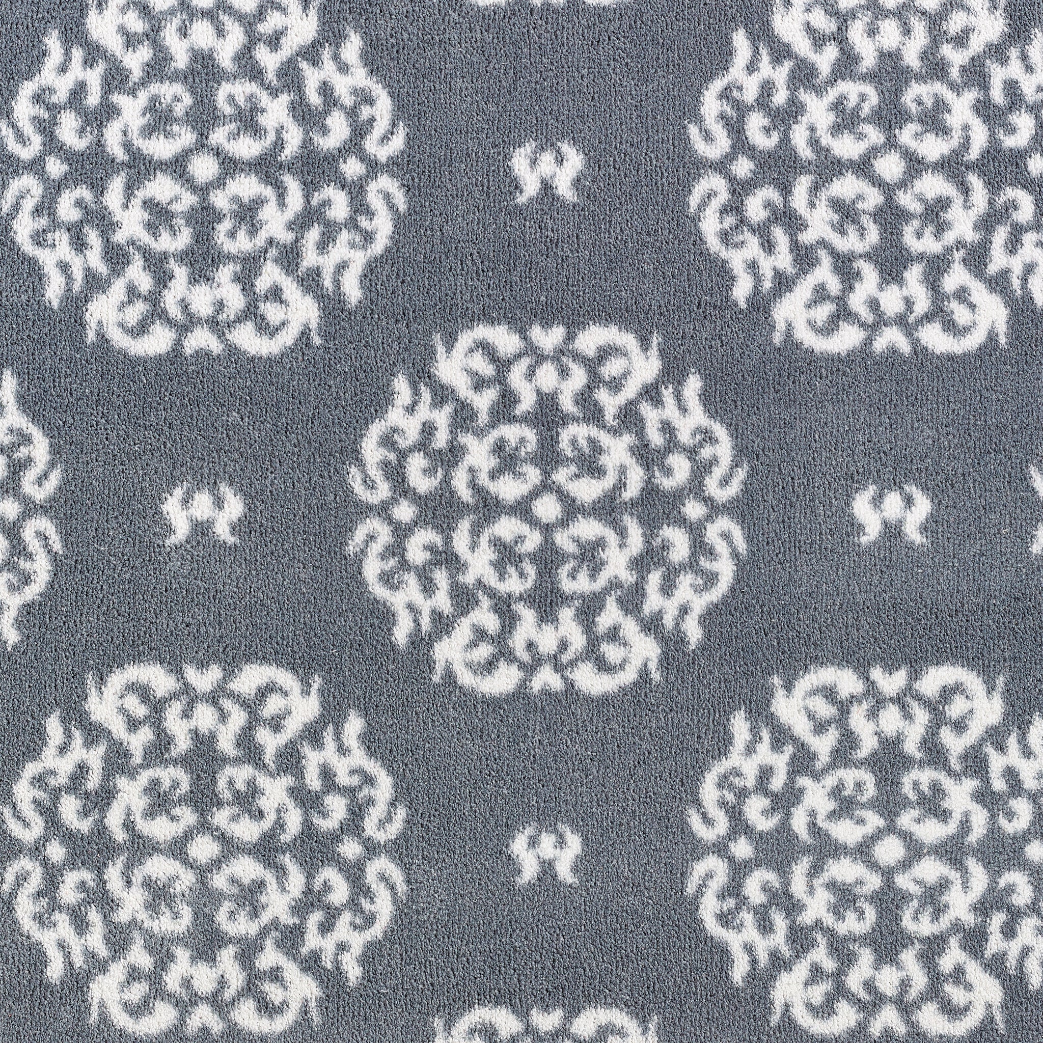 Close-up of Hug Rug heart and house design