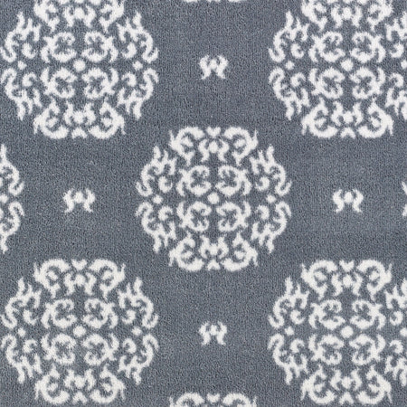 Close-up of Hug Rug heart and house design