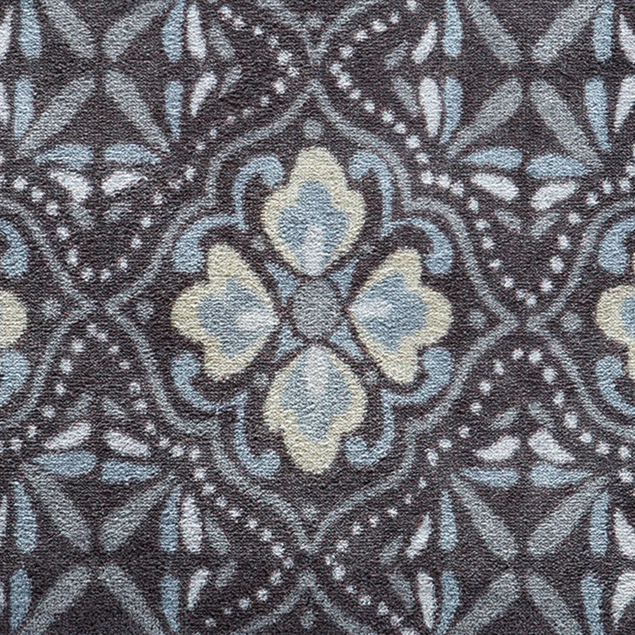 Close-up of Hug Rug heart and house design

