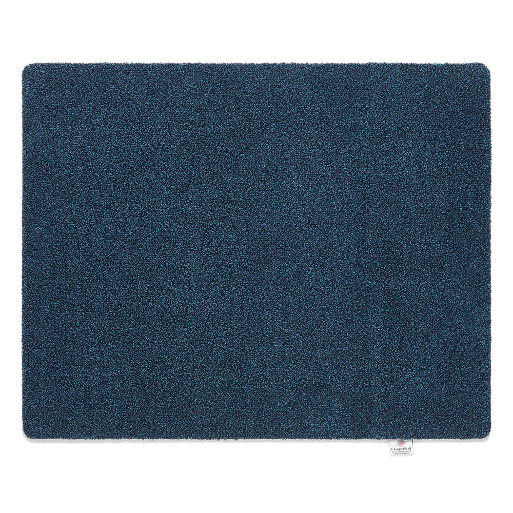 Solid blue rectangular rug on a white background