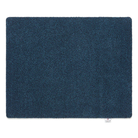 Solid blue rectangular rug on a white background