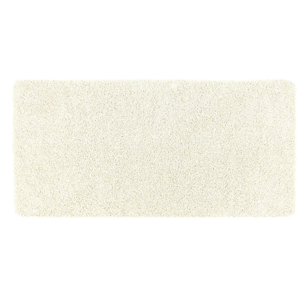 Rectangular beige bath mat on a white background