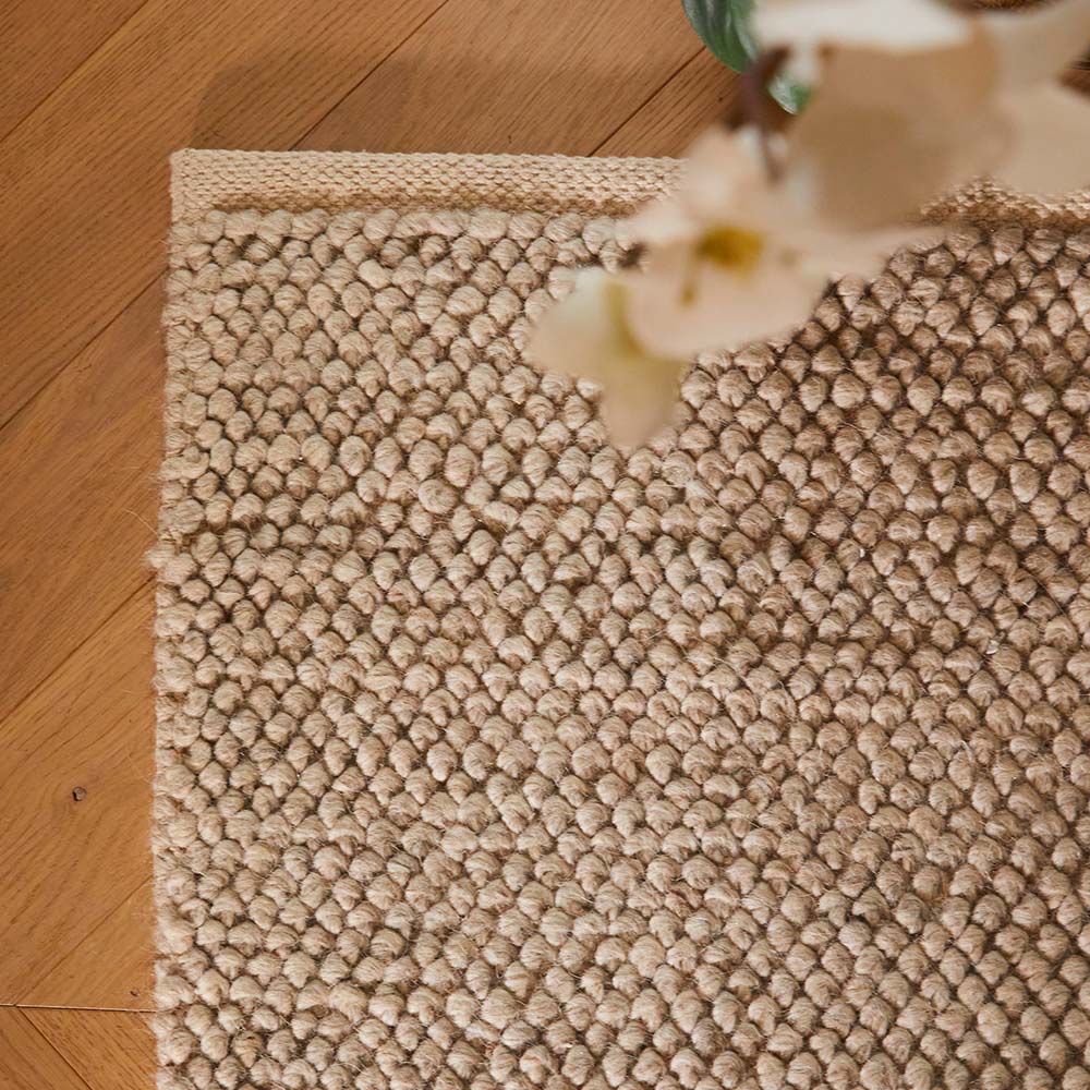 Hand woven beach-inspired wool blend rug