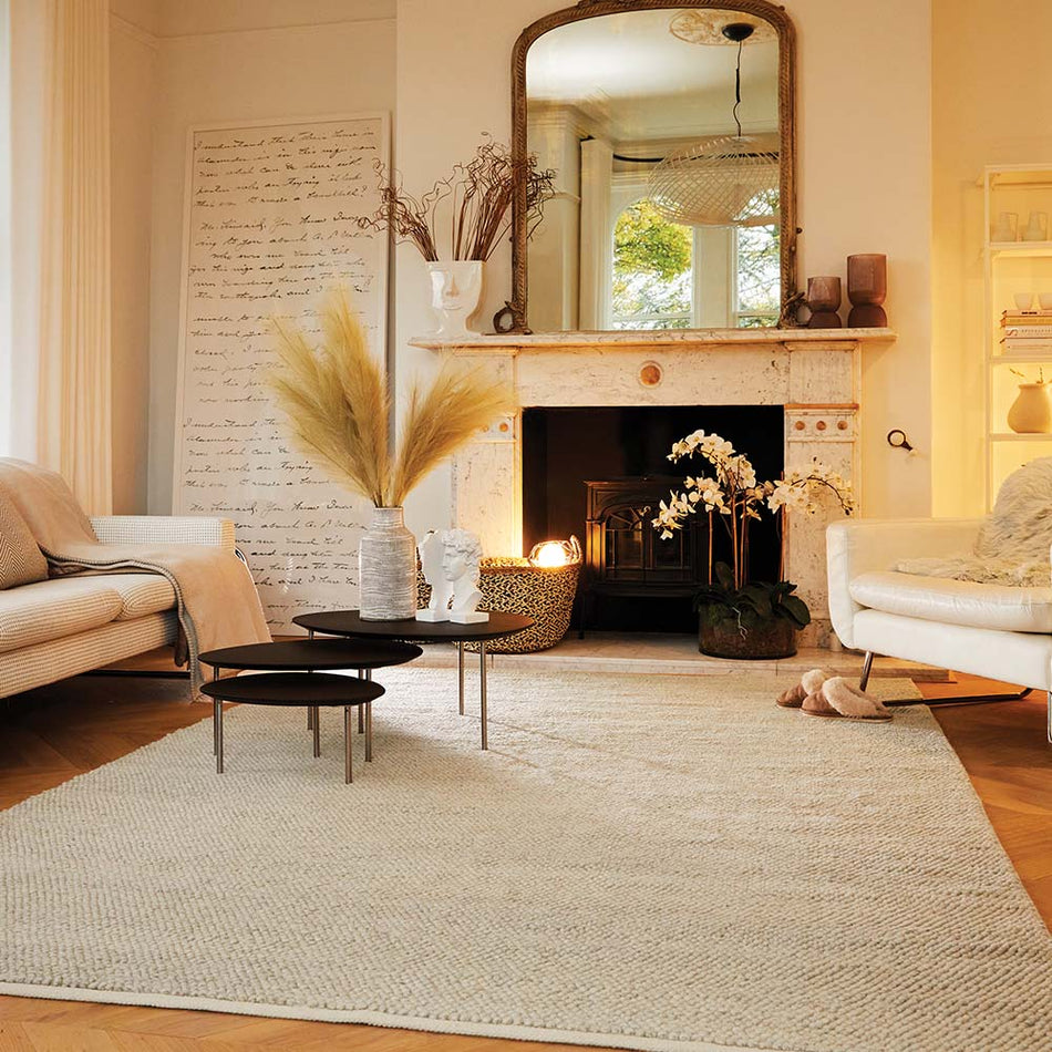 Modern natural textured rug laid on hardwood floor