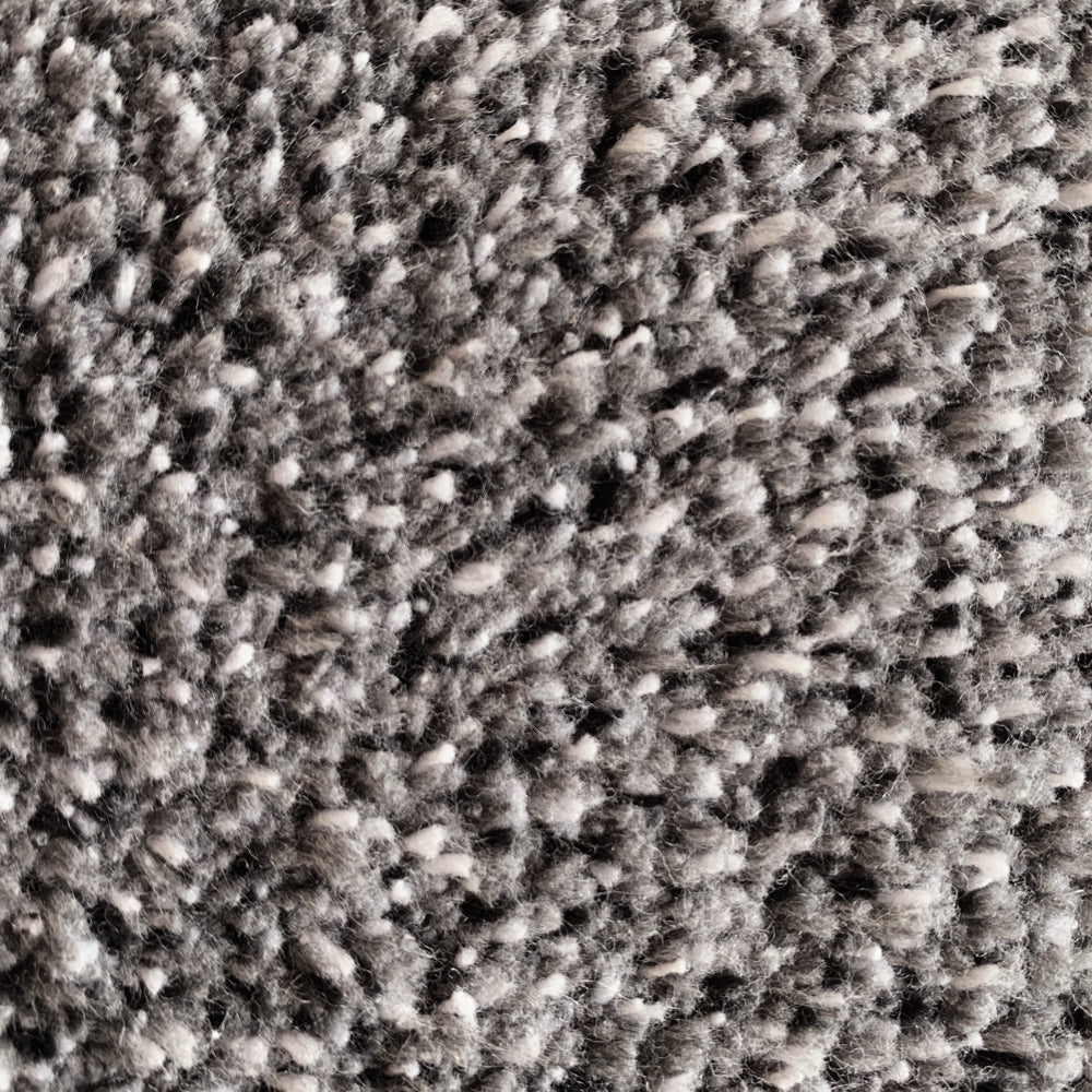 Close-up of Hug Rug light grey fleck texture

