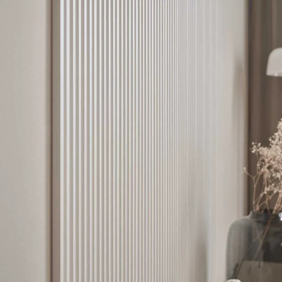 white vertical wall panel with slim slats

