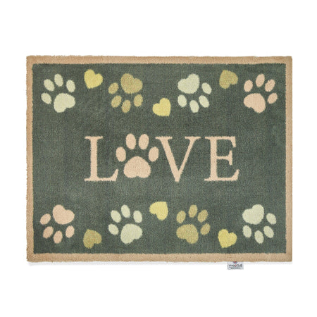 Hug Rug Love Paws doormat with charcoal background and paw heart design


