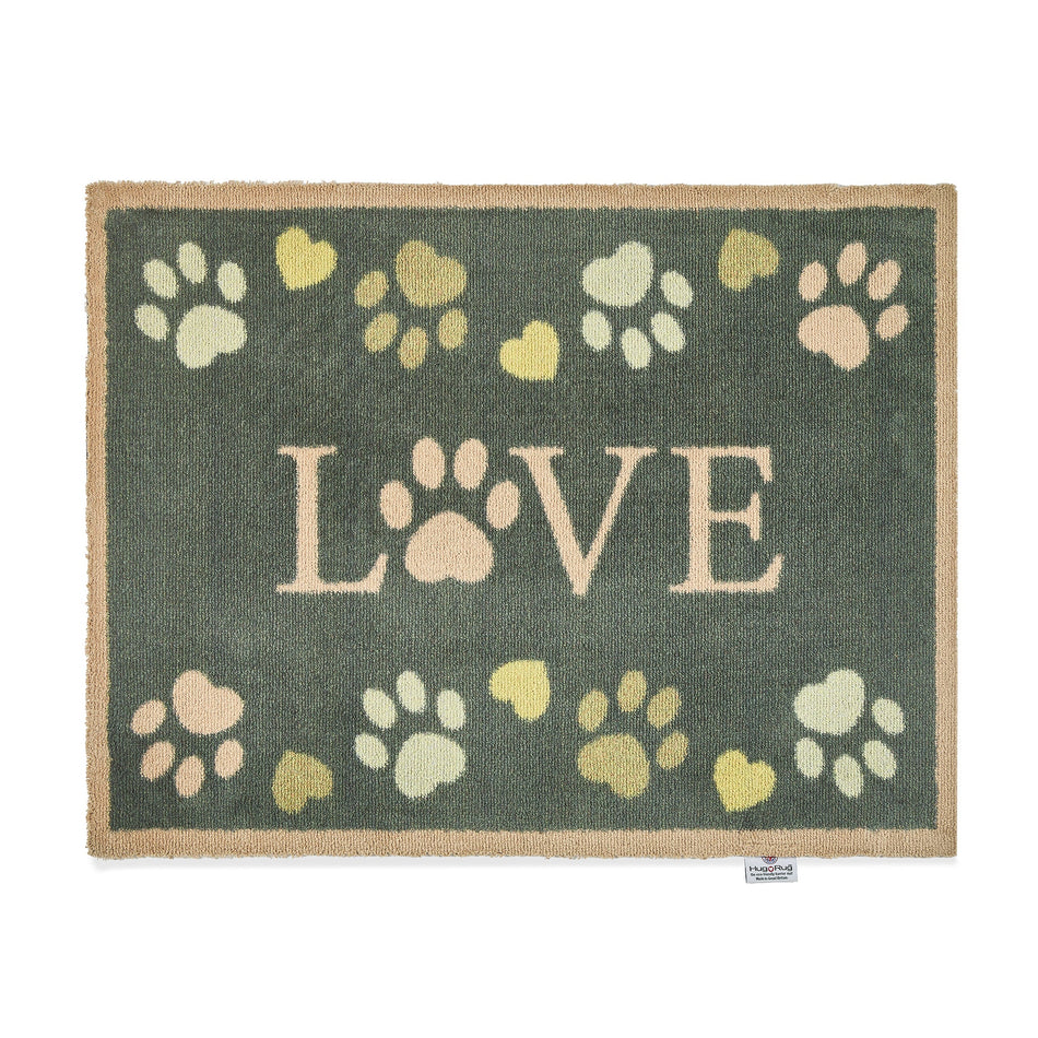 Hug Rug Love Paws doormat with charcoal background and paw heart design

