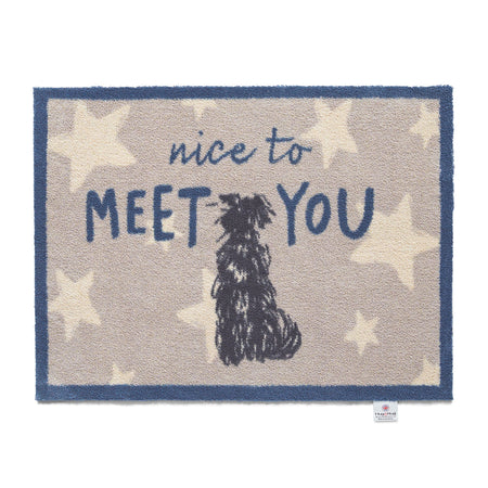 Doormat with a dog illustration and 'nice to meet you' text on a star-patterned background