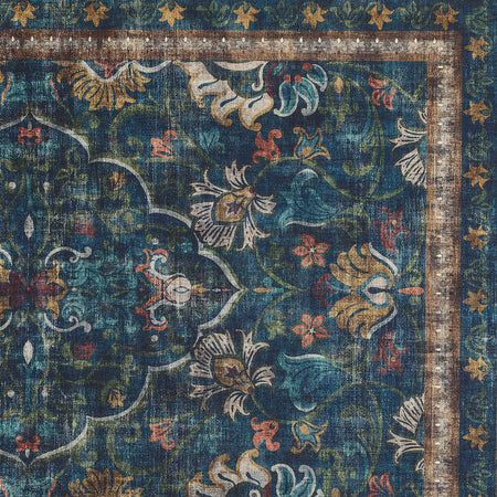 Decorative rug with intricate floral patterns in blue, gold, and red on a dark background.