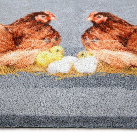 Close-up of Hug Rug hen and chick design

