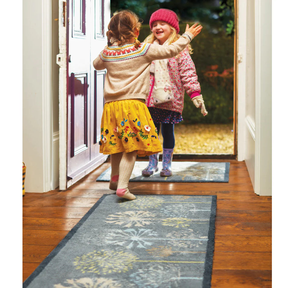 Eco-friendly Hug Rug mat by doorway

