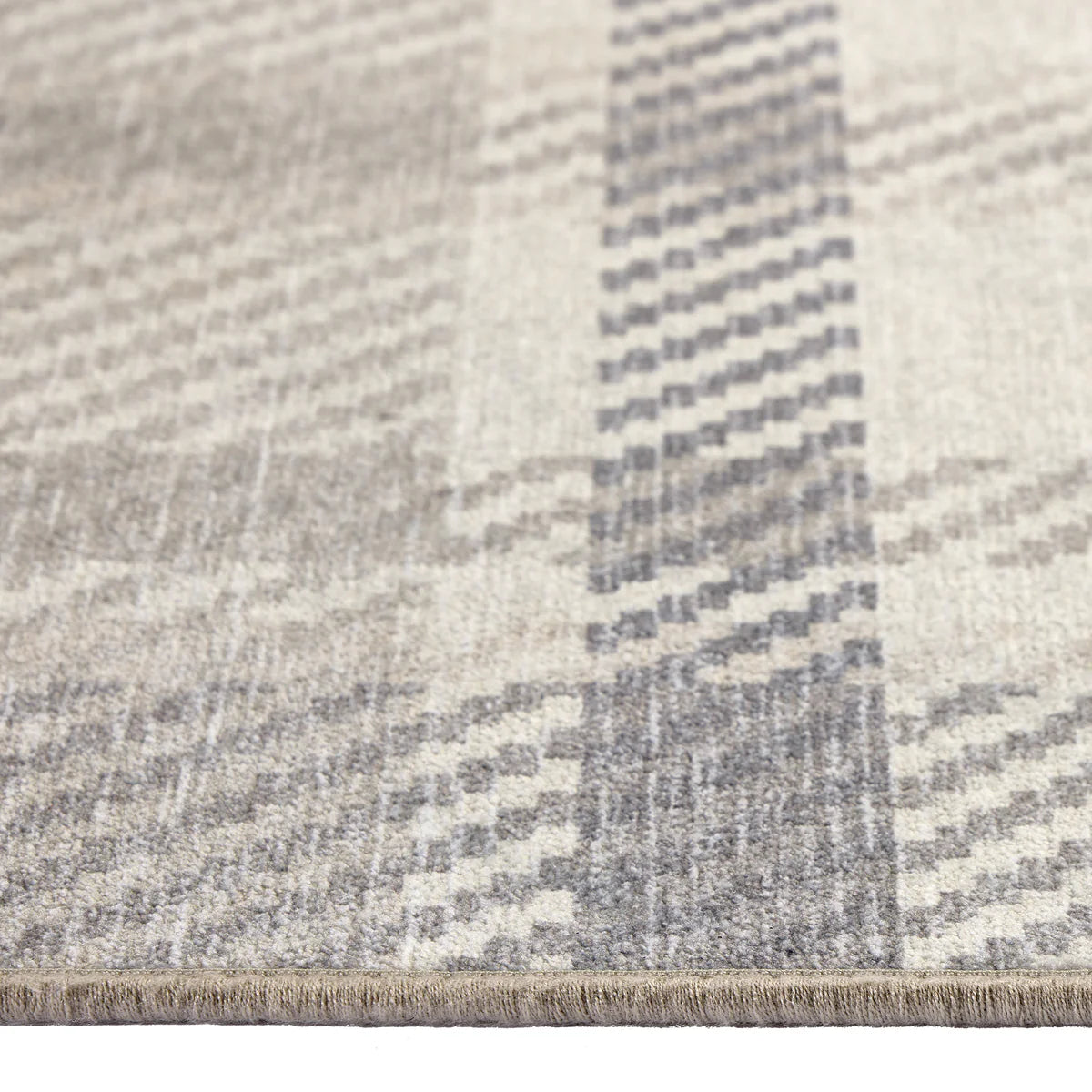 Close-up of a textured rug with a geometric pattern