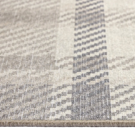Close-up of a textured rug with a geometric pattern