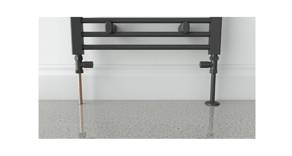 Talon Snappit Anthracite Cover fitted over 15mm radiator pipe with matching collar for a sleek, contemporary finish