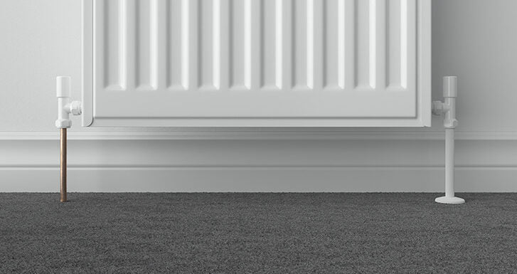 Talon Snappit White Pipe Cover fitted over 15mm radiator pipe with matching white collar for a neat finish