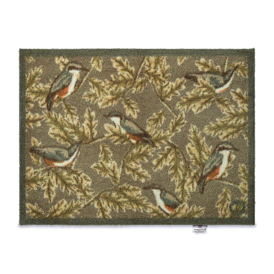 Decorative rug with bird and leaf pattern on a white background