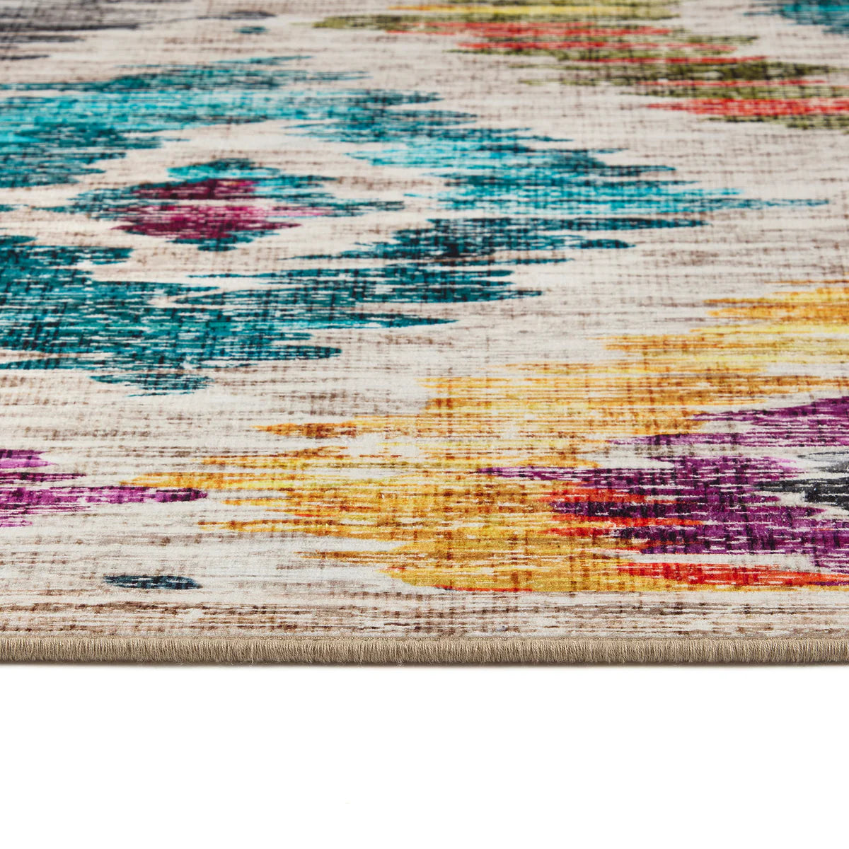 Close-up of a multicolored textured rug with abstract patterns.