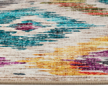 Close-up of a multicolored textured rug with abstract patterns.