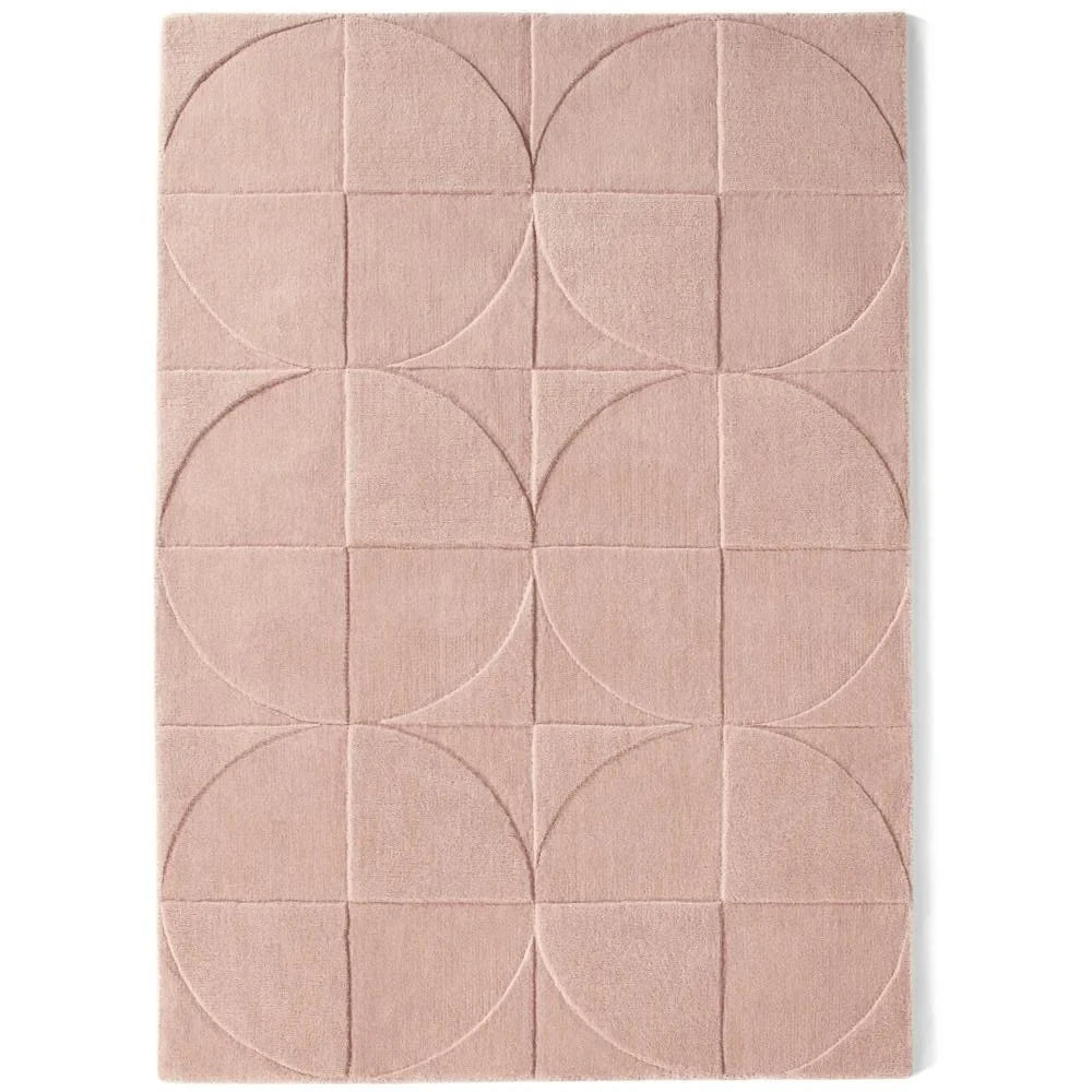 Origins Penny Rug Blush pink wool rug on white background