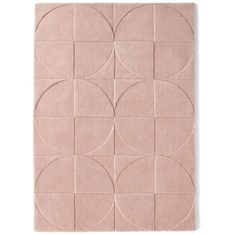 Origins Penny Rug Blush pink wool rug on white background
