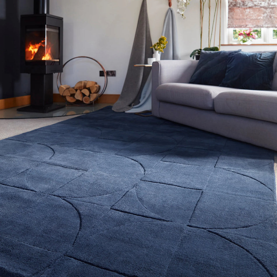 Origins Penny Rug Infinity dark blue wool rug in living room