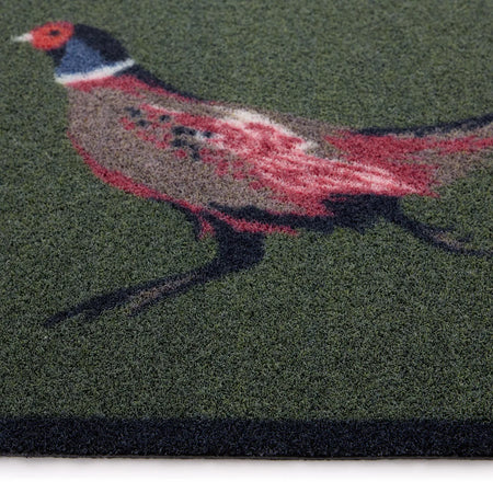 Doormat with a colorful pheasant design on a green background