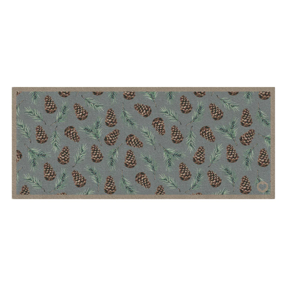 Hug Rug Runner Pinecones washable doormat on duck egg background