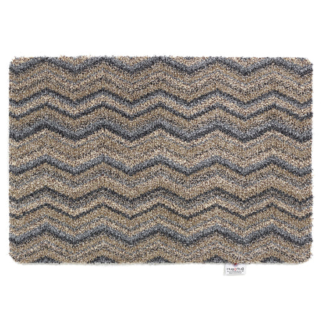 Hug Rug Ribbon Grey Zigzag mat with navy, beige, blue, and white pattern

