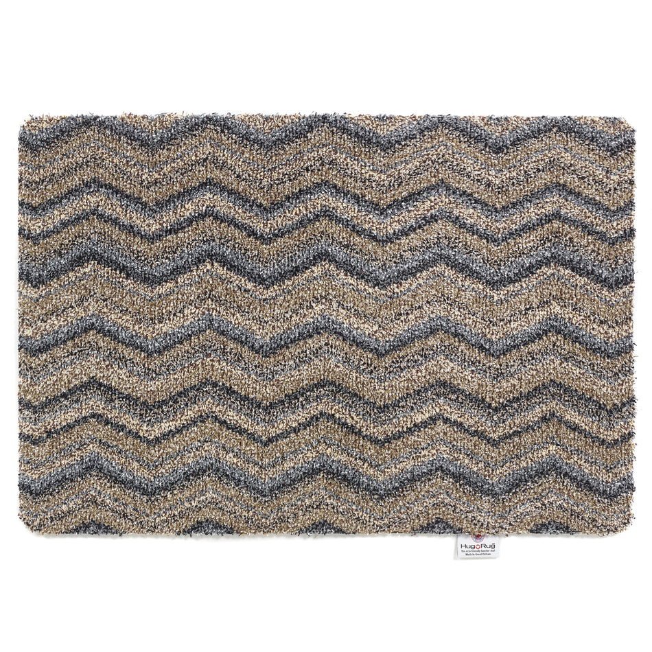 Hug Rug Ribbon Grey Zigzag mat with navy, beige, blue, and white pattern

