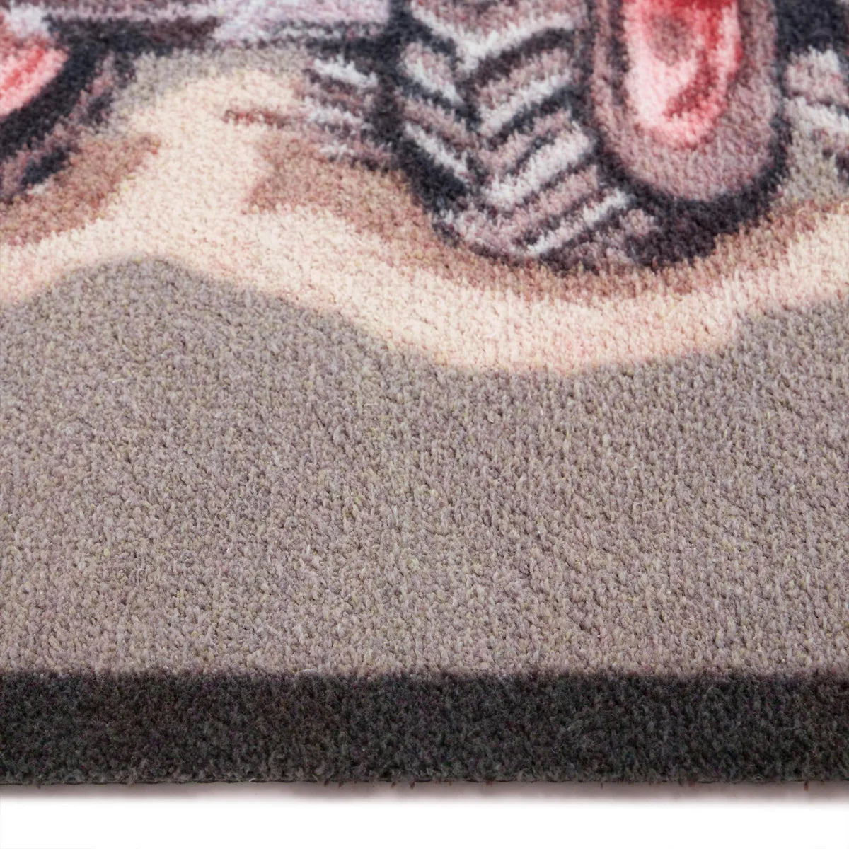 Close-up of red tractor illustration on beige background