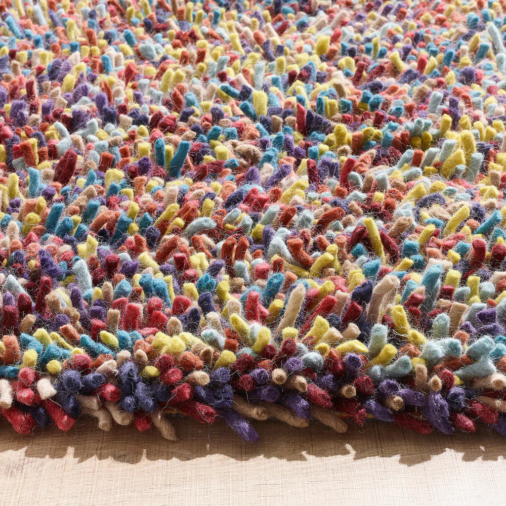 Close-up of textured wool multi colour pile in Origins Rocks rug