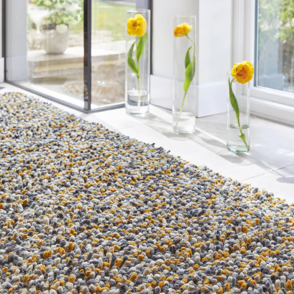 Hand woven shaggy rug in ochre and earth tones
