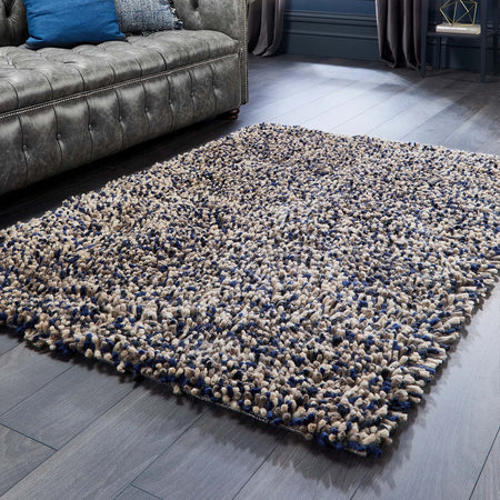 Multi-yarn navy shaggy rug from Origins