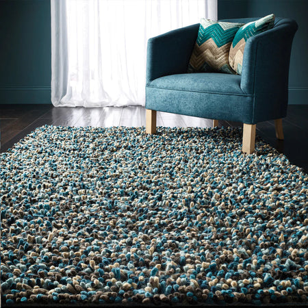 Hand woven origins rocks blue shaggy rug in living room