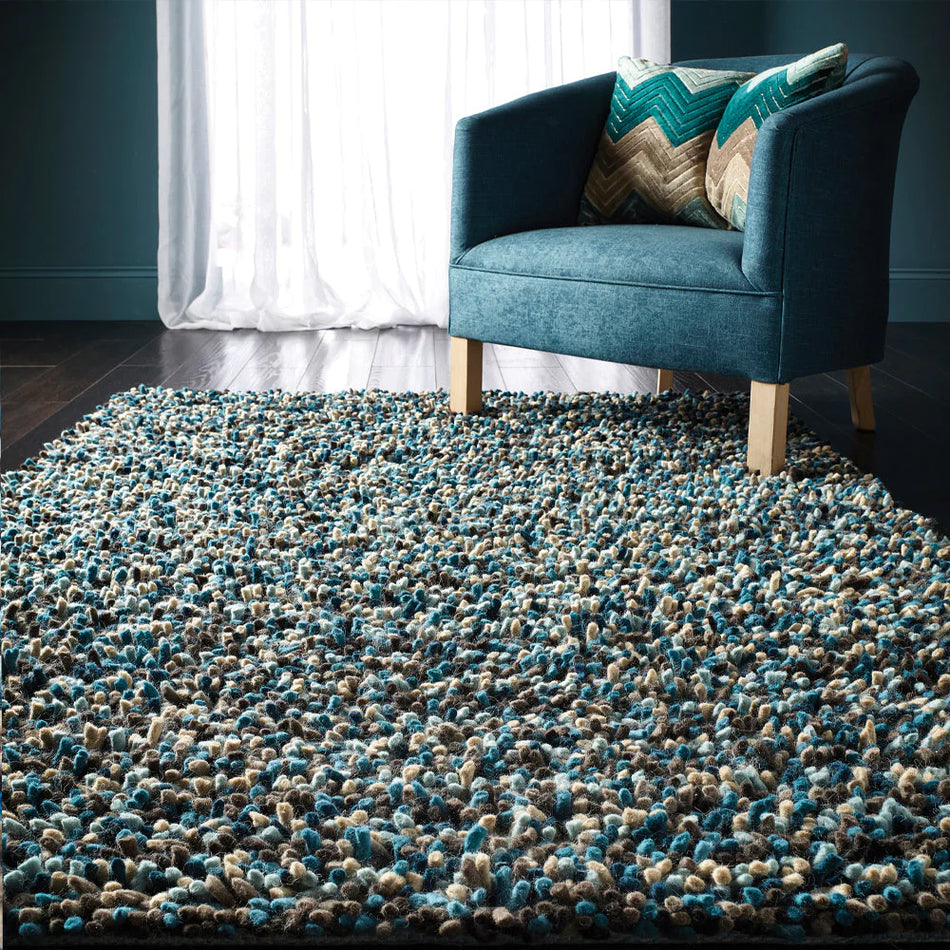 Hand woven origins rocks blue shaggy rug in living room