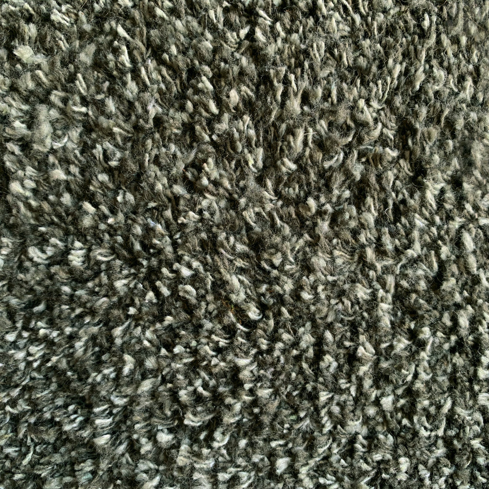 Close-up of Hug Rug sage green fleck texture

