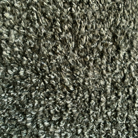 Close-up of Hug Rug sage green fleck texture

