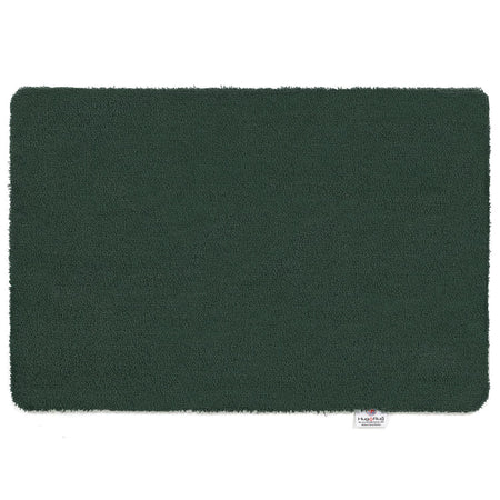 Hug Rug Sense Bath Mat in Forest Green displayed in a modern bathroom

