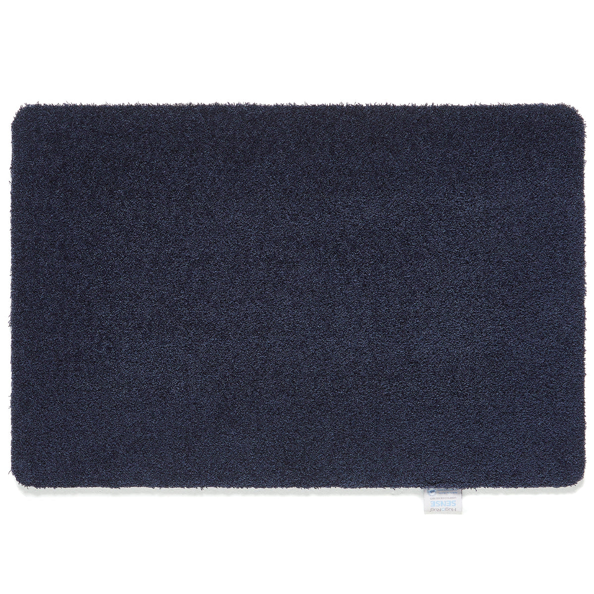Hug Rug Sense Bath Mat in French Navy displayed in a modern bathroom


