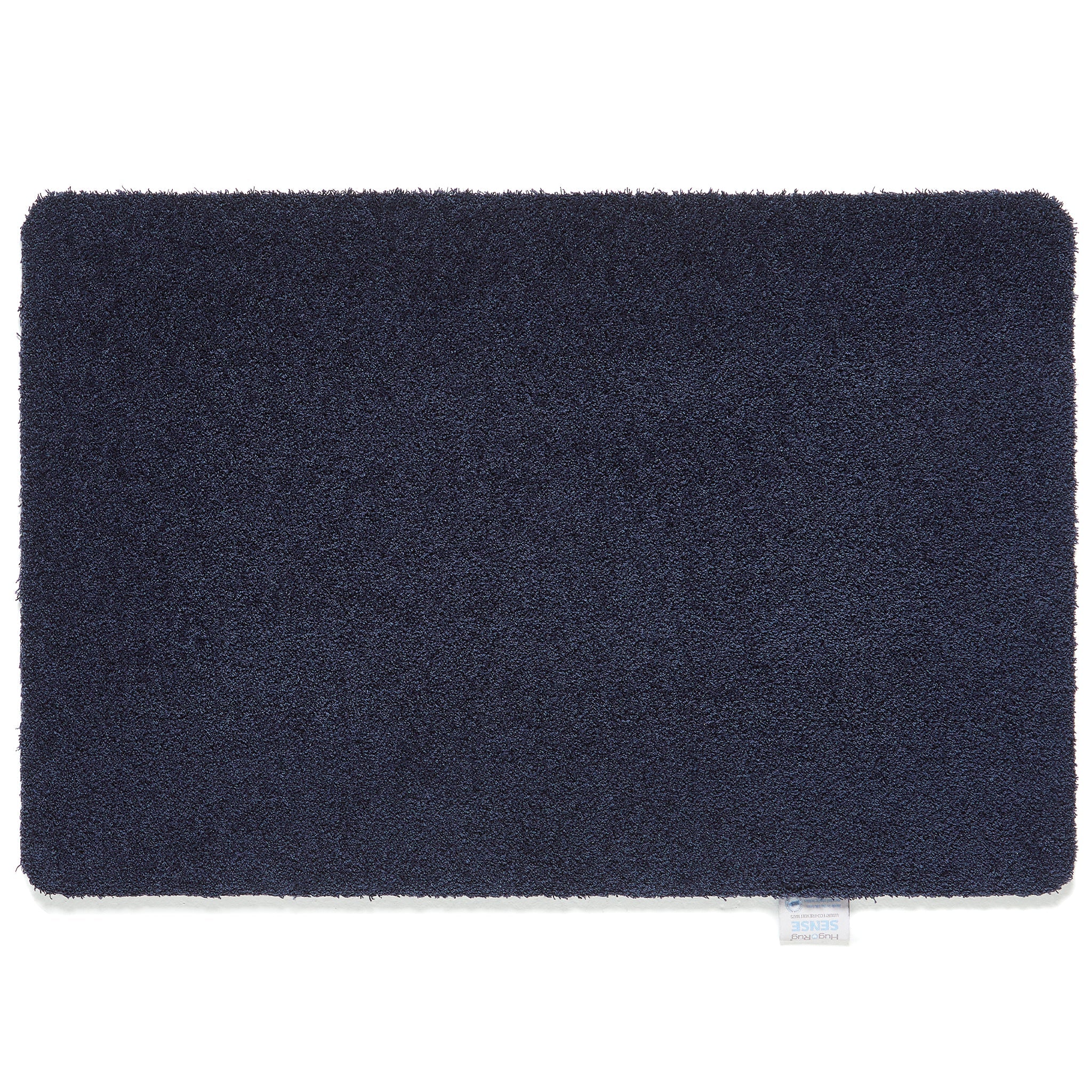Hug Rug Sense Bath Mat in French Navy displayed in a modern bathroom

