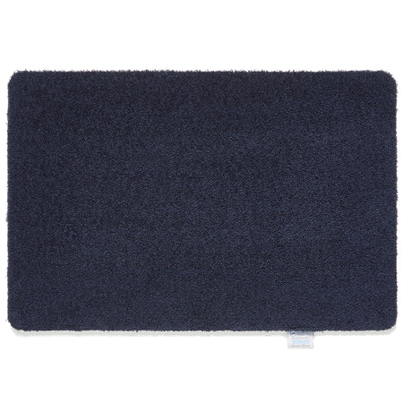 Hug Rug Sense Bath Mat in French Navy displayed in a modern bathroom

