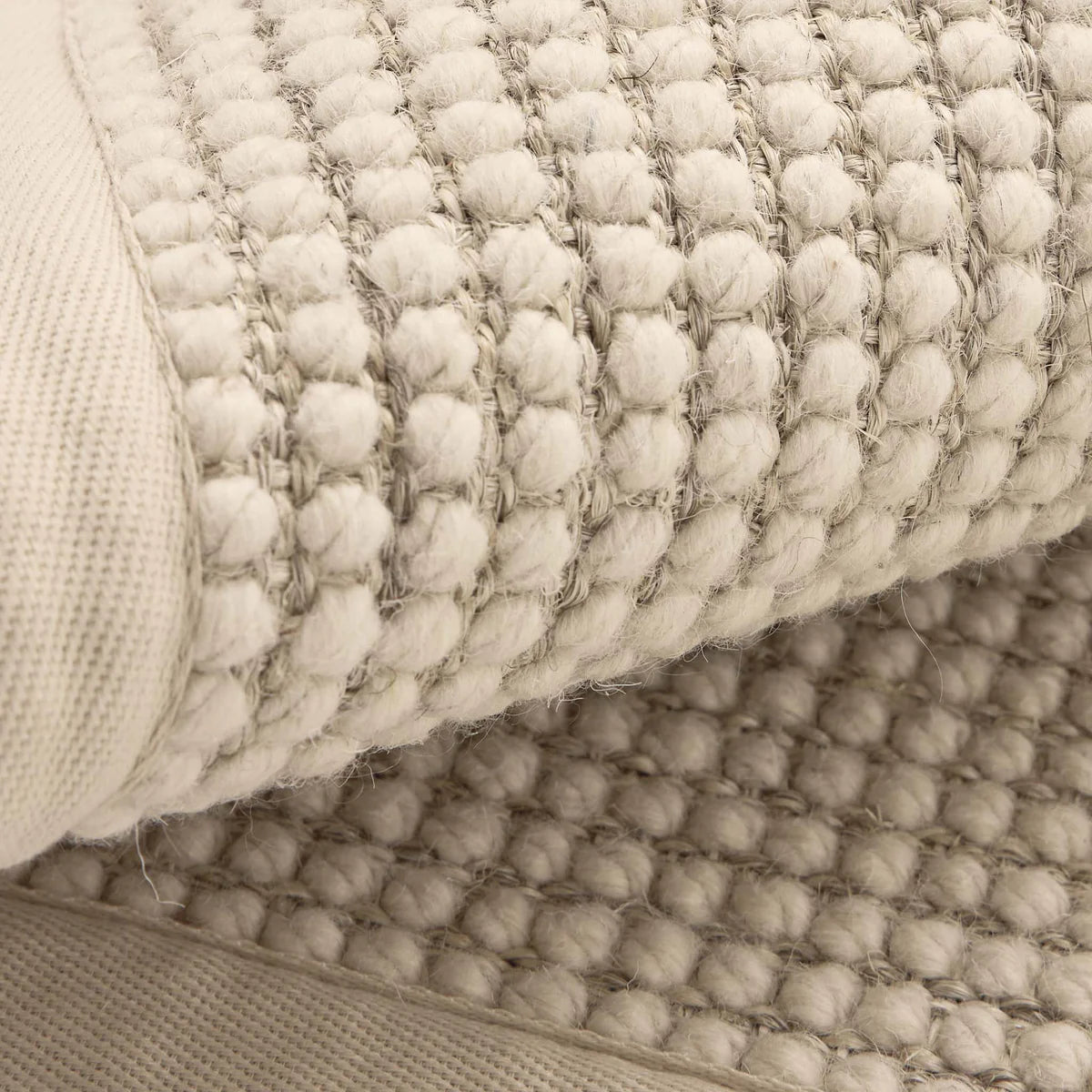 Origins Sisal Bouclé Beige Rug Close-up of textured beige rug with woven pattern