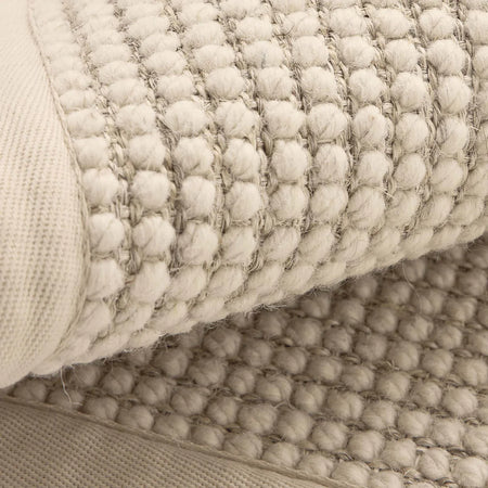 Origins Sisal Bouclé Beige Rug Close-up of textured beige rug with woven pattern