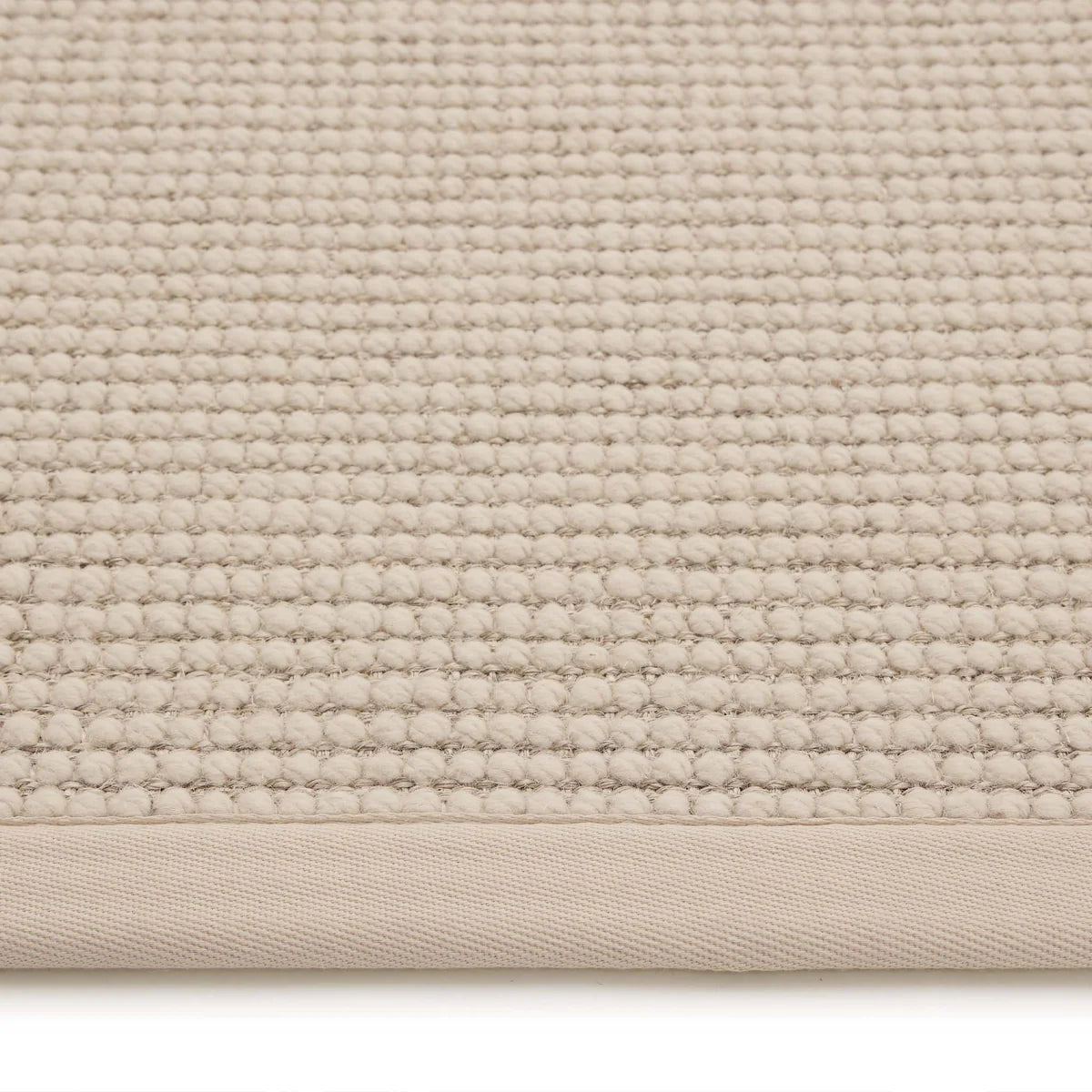 Close-up of beige rug weave and texture