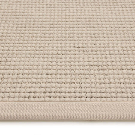 Close-up of beige rug weave and texture