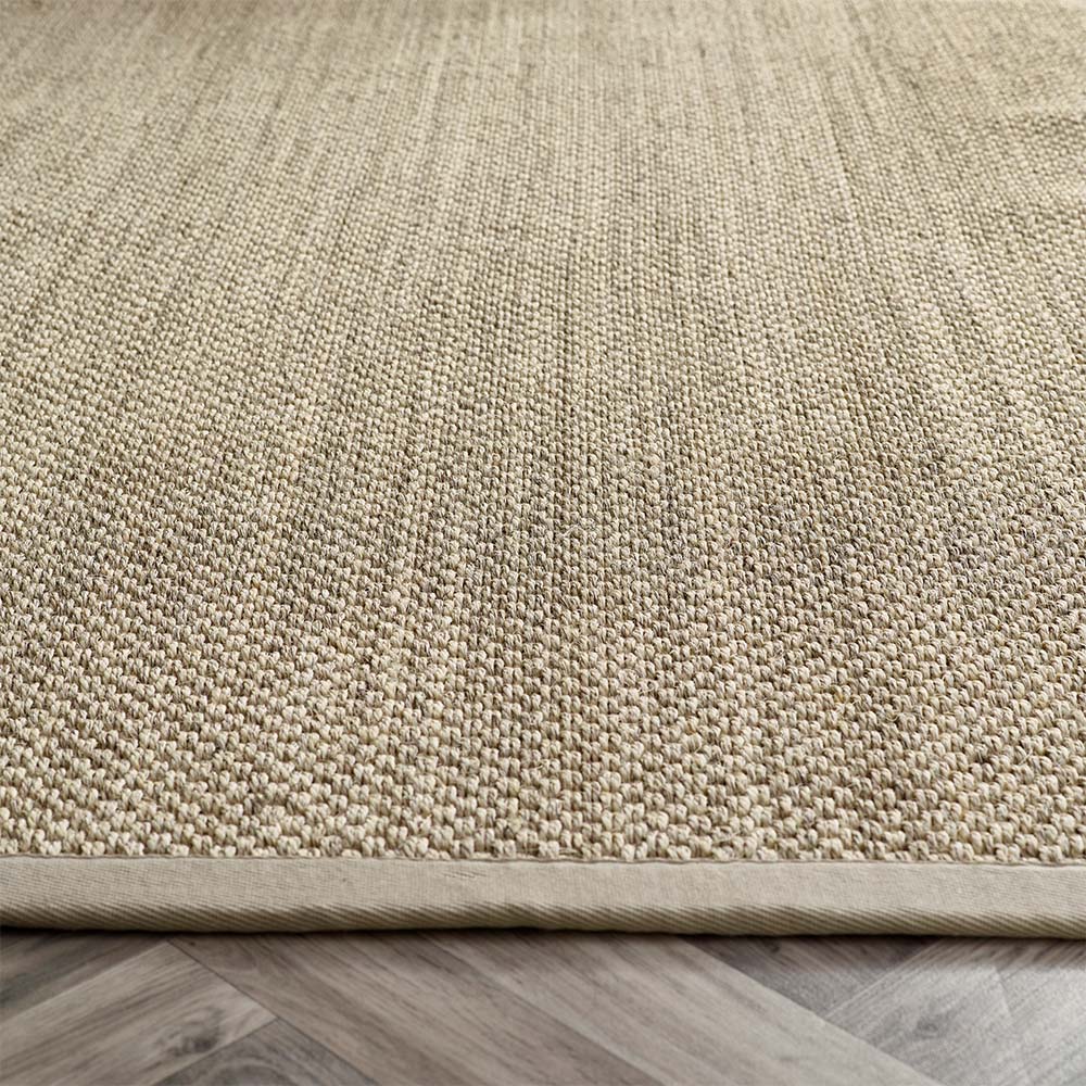 Close-up of sisal Light Beige with Sand Border rug texture with sand border