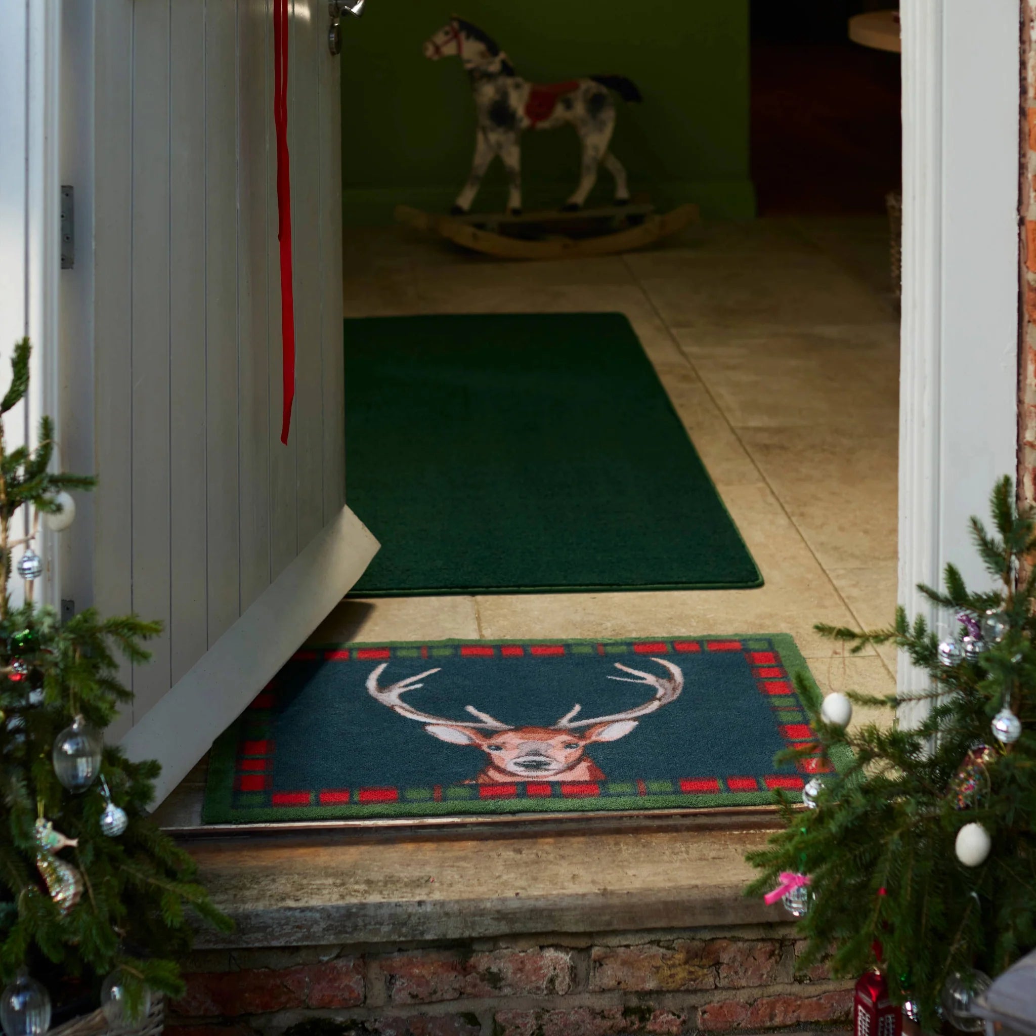 Hug Rug Tartan Stag catching dirt at entrance

