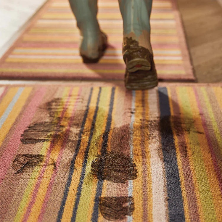 Brown bordered eco doormat with red, green, and orange stripes

