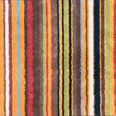 Close-up of Hug Rug Modern Stripe 70’s cotton surface

